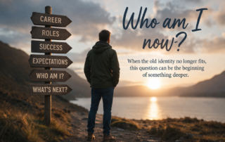 Person standing at a crossroads in nature reflecting on the question who am I now during a life transition